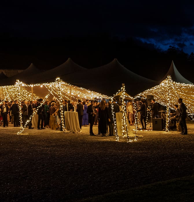 Special events Illuminated marquee with people celebrating