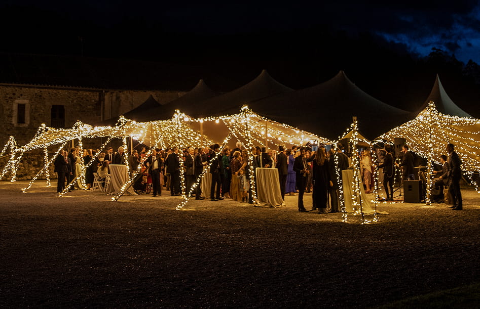 Special events Illuminated marquee with people celebrating