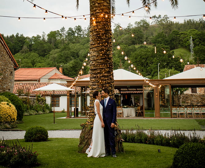 Venue | Exterior spaces 1 The bride and groom posing in the gardens of the estate