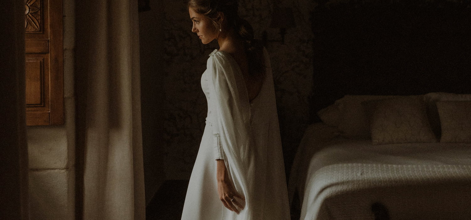 Contact Weddings Bride in her room looking out of the window