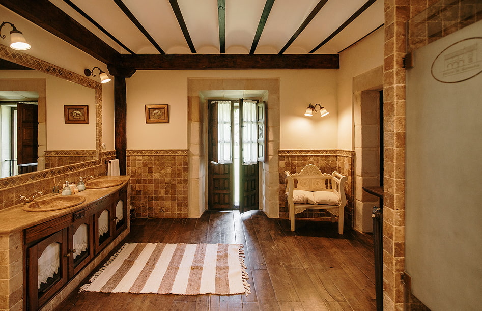 Presidential Suite 7 Bathroom with double washbasin and armchair in the background